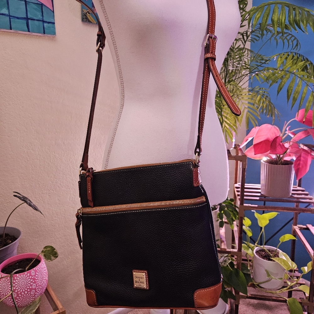 Dooney & Bourke Black Pebbled Leather Crossbody with Brown Trim.